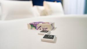 Cama o camas de una habitación en Soho Boutique Congreso
