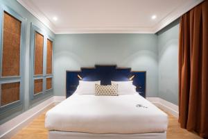 Cama o camas de una habitación en Soho Boutique Congreso