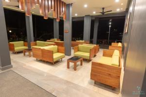 a lobby with couches and chairs in a building at Mimpi Perhentian in Perhentian Island +20 photos