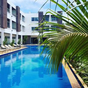 a large swimming pool in front of a building at Lanta Sport Resort in Ko Lanta