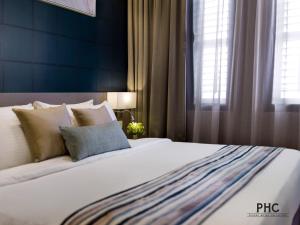 Postel nebo postele na pokoji v ubytování Ropewalk Piazza Hotel Managed by The Ascott Limited