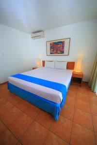 Ένα ή περισσότερα κρεβάτια σε δωμάτιο στο Concordia Hotel Bumi Sangkuriang Bandung
