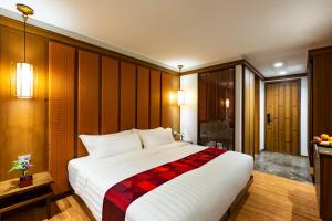 Postel nebo postele na pokoji v ubytování Lavana Hotel Chiangmai