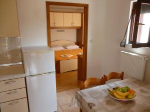 Kuchyň nebo kuchyňský kout v ubytování Apartments Pjer + 20 fotografií