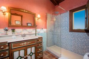 a bathroom with a sink and a shower at Hacienda Los Olivos in Ronda +25 photos
