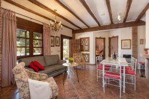 a living room with a couch and a table at Hacienda Los Olivos in Ronda