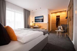 Postel nebo postele na pokoji v ubytování Hotel Tannenhaus