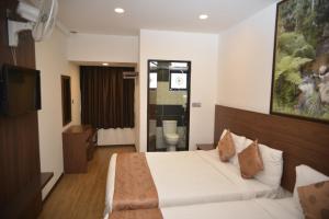 Postel nebo postele na pokoji v ubytování Highlanders Hotel