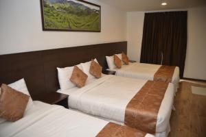 Postel nebo postele na pokoji v ubytování Highlanders Hotel