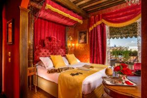 a bedroom with a large bed and a large window at Boutique Hotel Campo de' Fiori in Rome