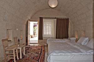 Postel nebo postele na pokoji v ubytování Maze Of Cappadocia Hotel