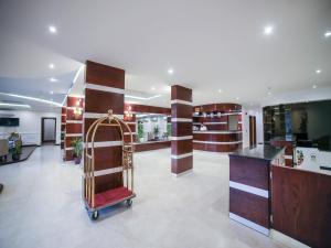 a store lobby with a luggage cart in the middle at نايت ان للشقق المخدومة in Al Khobar