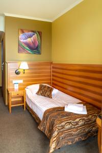 Łóżko lub łóżka w pokoju w obiekcie Eco Active Resort PIENINY
