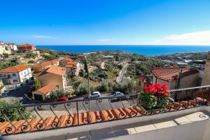 a view of the ocean from a balcony at Casa Bellavista in Terzorio