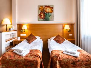 Łóżko lub łóżka w pokoju w obiekcie Eco Active Resort PIENINY