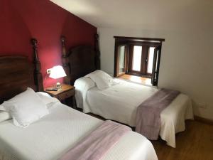 Ένα ή περισσότερα κρεβάτια σε δωμάτιο στο Casa Navarro +3 φωτογραφίες