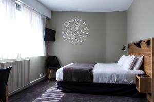 Postel nebo postele na pokoji v ubytování Mon Hotel à Gap