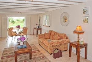 a living room with a couch and a table at Bellfry at Old Boley in Wexford