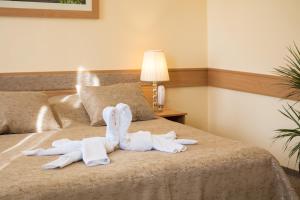 Posteľ alebo postele v izbe v ubytovaní Aquasol Resort