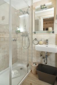 a bathroom with a shower and a sink at Apartments Villa Cambi in Split