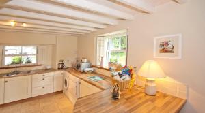 a kitchen with a table with a lamp on it at Bellfry at Old Boley in Wexford