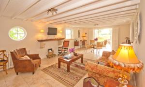 a living room with a couch and chairs at Bellfry at Old Boley in Wexford