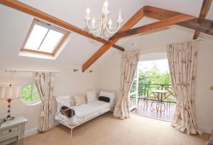 a living room with a couch and a window at Bellfry at Old Boley in Wexford