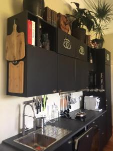 a kitchen with a sink and a shelf with books at Annamult Country House Estate in Kilkenny +58 photos