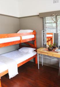 Letto o letti a castello in una camera di Garden Route Stay