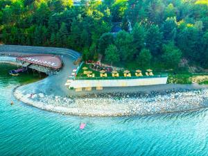 an aerial view of a resort on the water at Hotel Zelená Lagúna in Domaša Dobrá