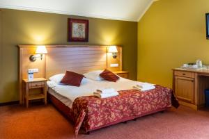 Łóżko lub łóżka w pokoju w obiekcie Eco Active Resort PIENINY