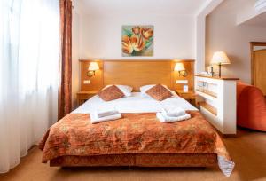 Łóżko lub łóżka w pokoju w obiekcie Eco Active Resort PIENINY