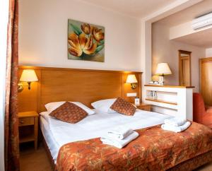 Łóżko lub łóżka w pokoju w obiekcie Eco Active Resort PIENINY