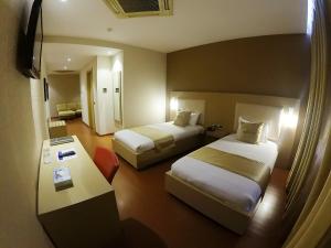 Postel nebo postele na pokoji v ubytování Sky 2 Hotel Tirana