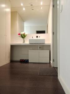 a bathroom with a sink and a white counter at YingYing Apartamento with a free parking space in Lisbon