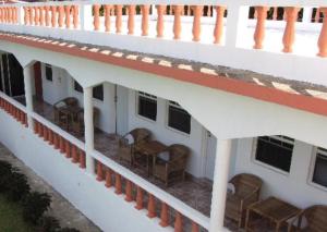 an upper deck of a cruise ship with chairs at Polish Princess Guest House in Port Antonio