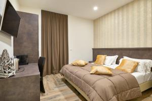 TV a/nebo společenská místnost v ubytování Ricaroka Hotel