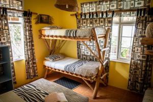 En eller flere senger på et rom på Ku-Boboyi River Lodge