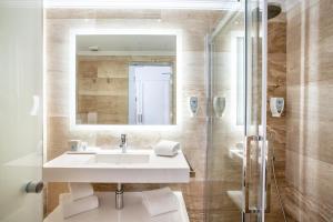 a bathroom with a sink and a shower at Grupotel Los Príncipes & Spa in Playa de Muro