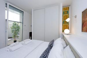 Posteľ alebo postele v izbe v ubytovaní Piazza del Popolo Apartment