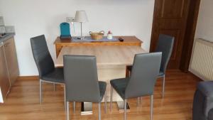 a dining room with a table and chairs at Haus Elisabeth in Mittersill