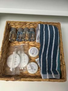a basket with towels and other items in it at Black Eagle Apartments in Prague