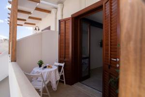 A balcony or terrace at Elisir Suite Rooms by Marino Tourist
