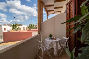 En balkon eller terrasse på Elisir Suite Rooms by Marino Tourist