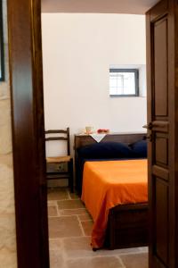 Postel nebo postele na pokoji v ubytování Trullo Dimora della Valle