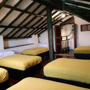 Postel nebo postele na pokoji v ubytování Cedron Hostel