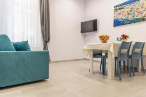 a living room with a table and a couch at La Casina Rossa in Naples