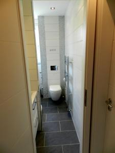 a bathroom with a toilet and a sink at Miramar in Bremerhaven
