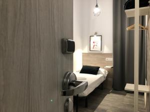 Cama o camas de una habitación en Hostal Rías Bajas