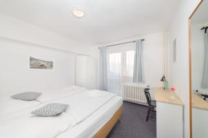 Ein Bett oder Betten in einem Zimmer der Unterkunft Hotel Horní Pramen